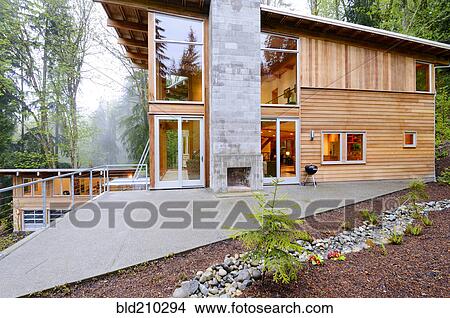 Picture - Outdoor fireplace of modern house. Fotosearch