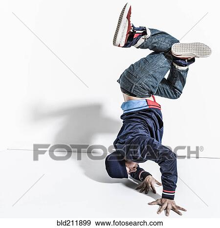 Pacific Islander dancer casting shadows on wall View Large Photo Image Stock Photo - Pacific Islander dancer casting shadows on wall. Fotosearch