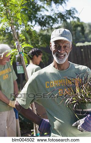 People planting community garden View Large Photo Image Stock Image - People planting community garden. Fotosearch