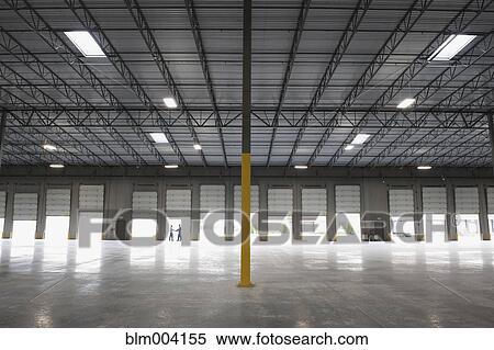People shaking hands at loading dock of empty warehouse View Large Photo Image Stock Photography - People shaking hands at loading dock of empty warehouse. Fotosearch