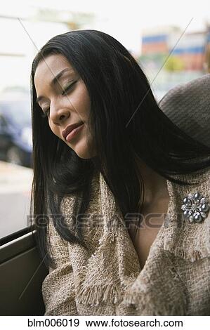 Pilipino woman sleeping on bus View Large Photo Image Stock Photo - Pilipino woman sleeping on bus. Fotosearch