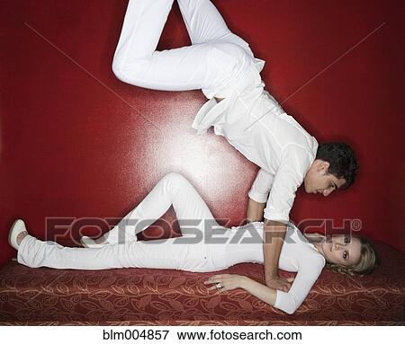Stock Photo - Playful couple in nightclub. Fotosearch