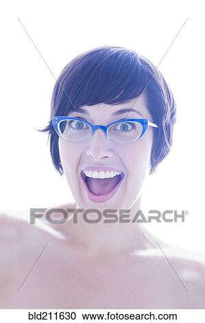 Stock Image - Portrait of surprised woman in eyeglasses. Fotosearch
