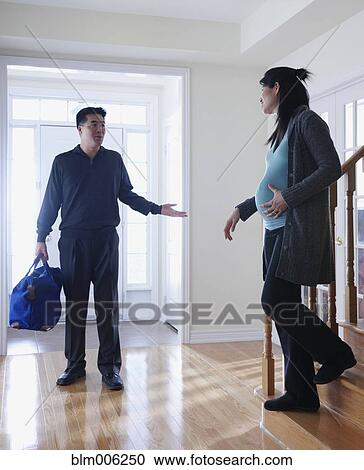 Pregnant Chinese woman leaving for hospital with husband View Large Photo Image Stock Image - Pregnant Chinese woman leaving for hospital with husband. Fotosearch
