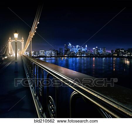 Stock Image - Railing on urban bridge at night, London, United Kingdom. Fotosearch