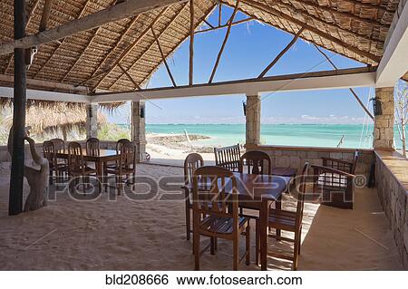 Restaurant with a beachfront view of the ocean View Large Photo Image Stock Photograph - Restaurant with a beachfront view of the ocean. Fotosearch