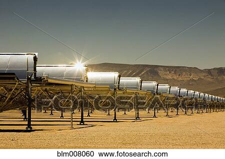 Rows of solar panels in desert View Large Photo Image Stock Image - Rows of solar panels in desert. Fotosearch