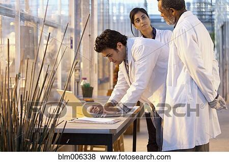 Stock Photo - Scientists working in laboratory. Fotosearch
