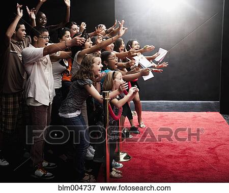 Screaming fans on the red carpet View Large Photo Image Stock Photo - Screaming fans on the red carpet. Fotosearch