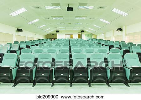 Stock Image - Seats in empty auditorium. Fotosearch