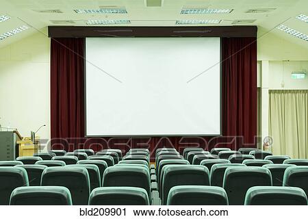Stock Image - Seats in empty auditorium. Fotosearch