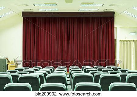 Stock Image - Seats in empty auditorium. Fotosearch