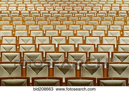Stock Image - Seats in empty theater. Fotosearch