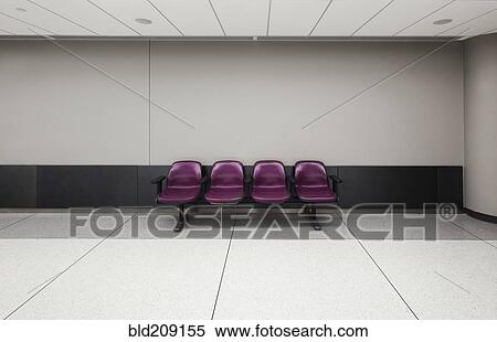 Stock Photography - Seats in empty waiting area in airport. Fotosearch