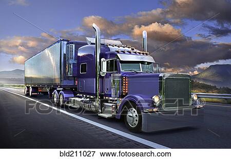 Semi truck driving on freeway View Large Photo Image Stock Photo - Semi truck driving on freeway. Fotosearch
