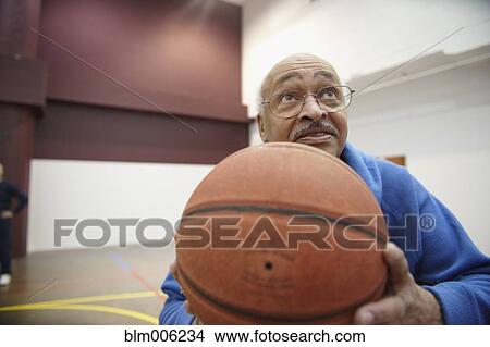 Senior African American playing basketball View Large Photo Image Picture - Senior African American playing basketball. Fotosearch