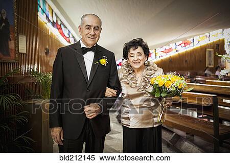 Stock Photography - Senior couple smiling at wedding. Fotosearch