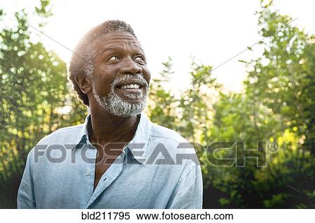 Senior man smiling outdoors View Large Photo Image Stock Photography - Senior man smiling outdoors. Fotosearch