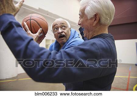 Senior men playing basketball View Large Photo Image Stock Image - Senior men playing basketball. Fotosearch