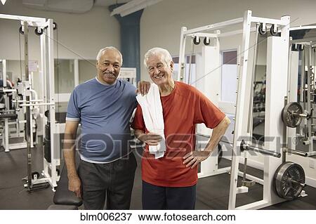 Senior men working out in health club View Large Photo Image Stock Photo - Senior men working out in health club. Fotosearch