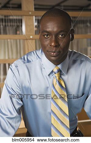 Serious Black businessman View Large Photo Image Picture - Serious Black businessman. Fotosearch