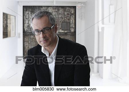 Stock Image - Serious Caucasian man in eyeglasses. Fotosearch
