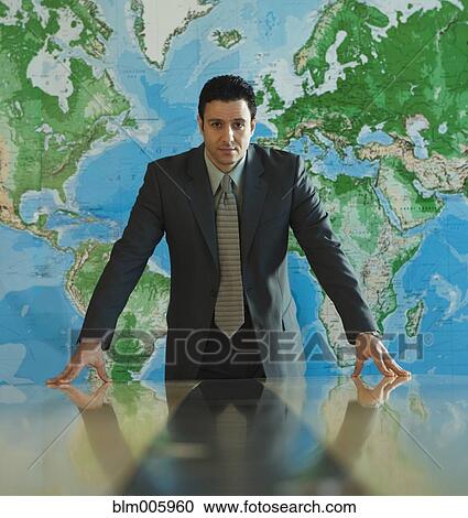Stock Image - Serious Middle Eastern businessman in conference room. Fotosearch