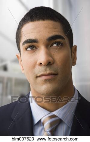 Serious mixed race businessman View Large Photo Image Stock Image - Serious mixed race businessman. Fotosearch