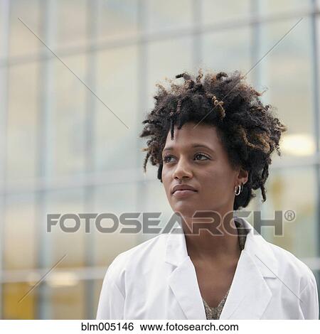 Stock Photograph - Serious mixed race doctor. Fotosearch