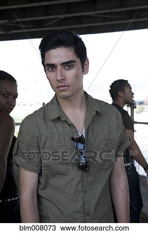 Stock Image - Serious mixed race teenage boy. Fotosearch