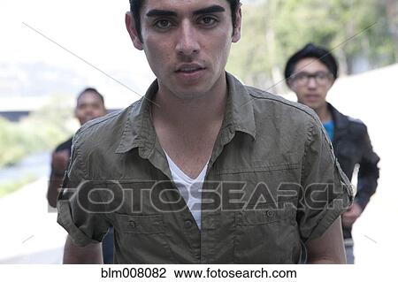 Stock Image - Serious teenage boy. Fotosearch