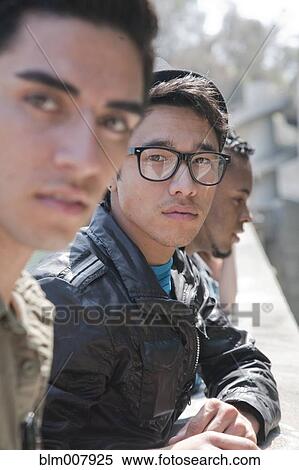 Serious teenage boys in a row View Large Photo Image Stock Photography - Serious teenage boys in a row. Fotosearch
