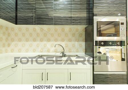Stock Photo - Small modern kitchen decorated by black glass. Fotosearch