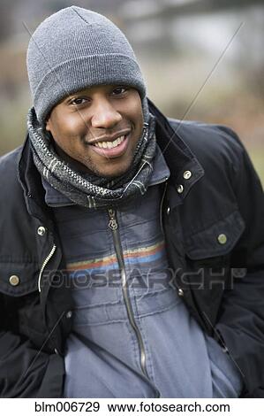 Stock Photo - Smiling African American man in cap. Fotosearch