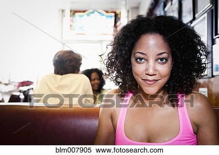 Smiling African American woman in diner View Large Photo Image Stock Photography - Smiling African American woman in diner. Fotosearch