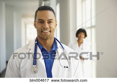 Smiling African doctor View Large Photo Image Stock Photo - Smiling African doctor. Fotosearch