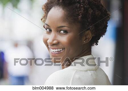 Stock Photo - Smiling African woman. Fotosearch