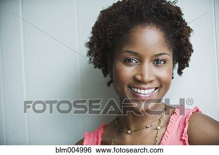 Stock Photograph - Smiling African woman. Fotosearch