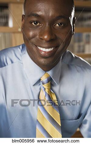 Stock Photograph - Smiling Black businessman. Fotosearch