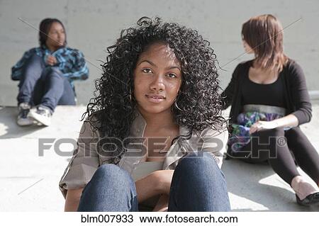 Stock Image - Smiling Black teenage girl. Fotosearch