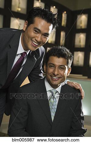 Smiling businessmen in restaurant View Large Photo Image Stock Photo - Smiling businessmen in restaurant. Fotosearch