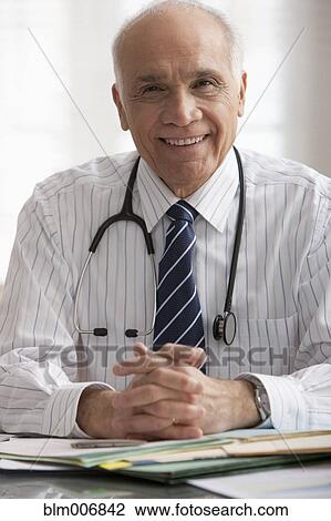 Stock Image - Smiling Hispanic doctor . Fotosearch