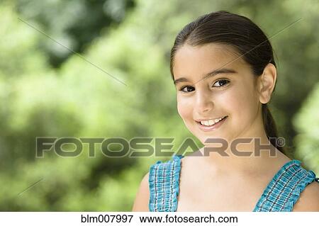 Stock Photo - Smiling Middle Eastern girl. Fotosearch