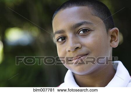 Smiling mixed race boy View Large Photo Image Stock Image - Smiling mixed race boy. Fotosearch