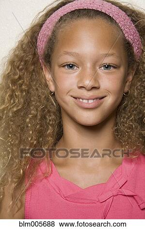 Stock Photo - Smiling mixed race girl. Fotosearch