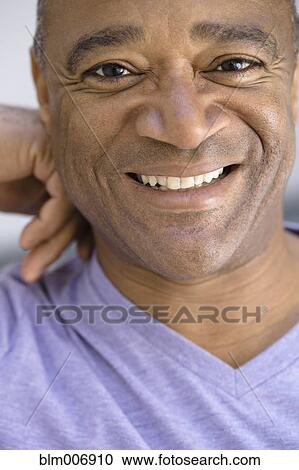 Stock Image - Smiling mixed race man. Fotosearch