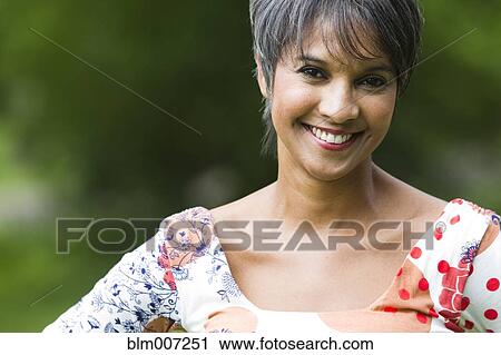 Smiling mixed race woman View Large Photo Image Stock Image - Smiling mixed race woman. Fotosearch