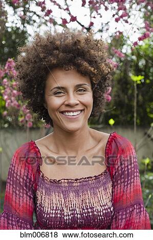 Stock Photo - Smiling mixed race woman. Fotosearch
