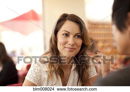 Smiling woman and man sitting face to face View Large Photo Image Picture - Smiling woman and man sitting face to face. Fotosearch