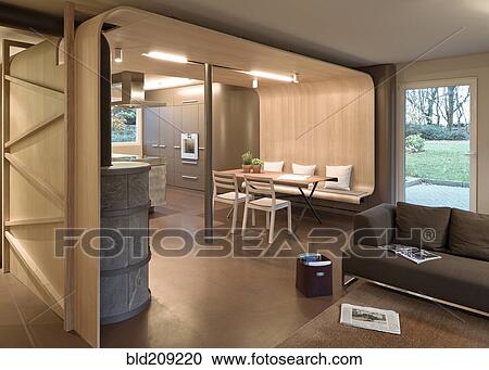 Stock Image - Sofa, dining table and chairs in modern home. Fotosearch